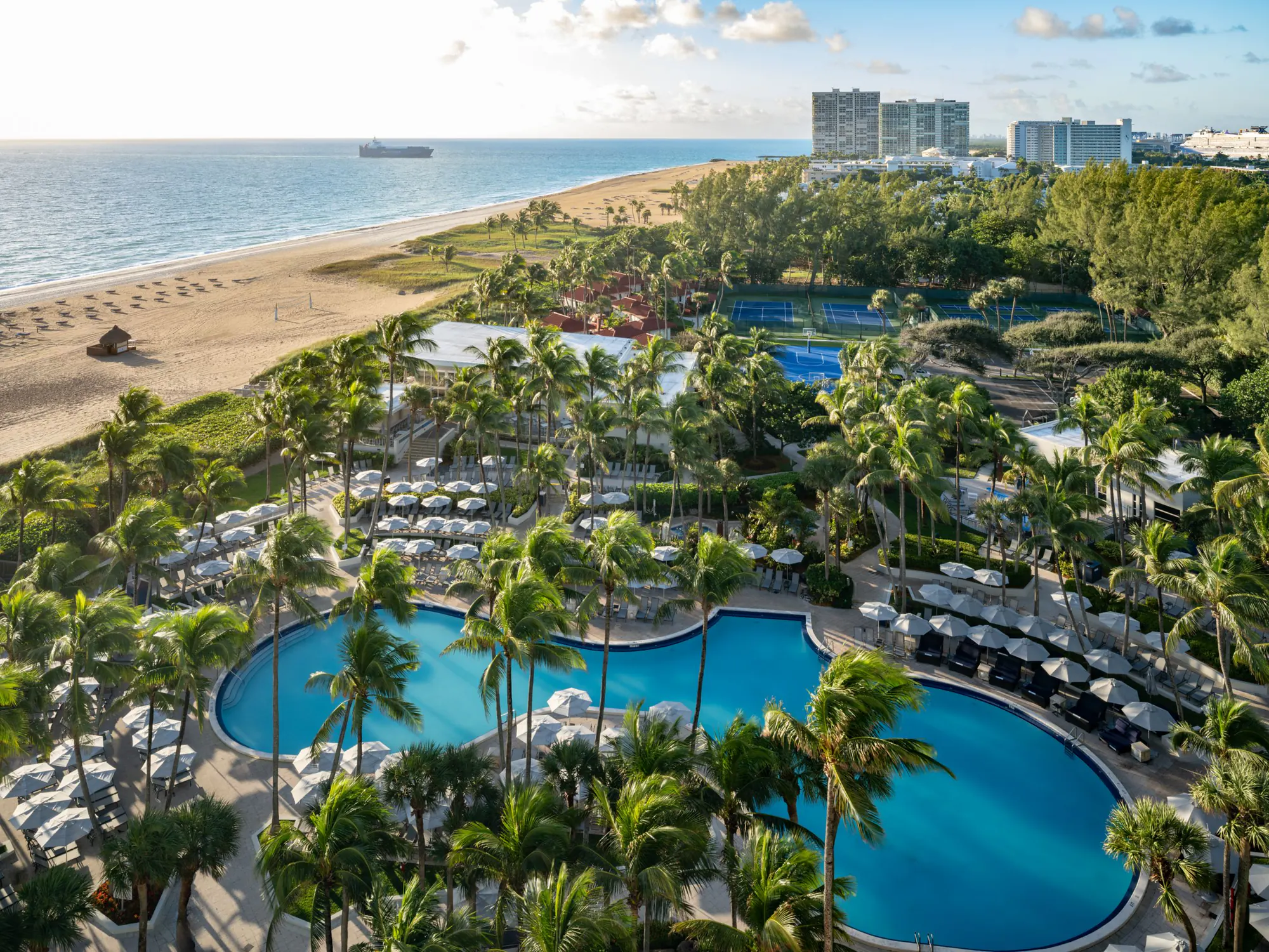 Ocean, beach and palms at Fort Lauderdale Marriott Harbor Beach Resort and Spa